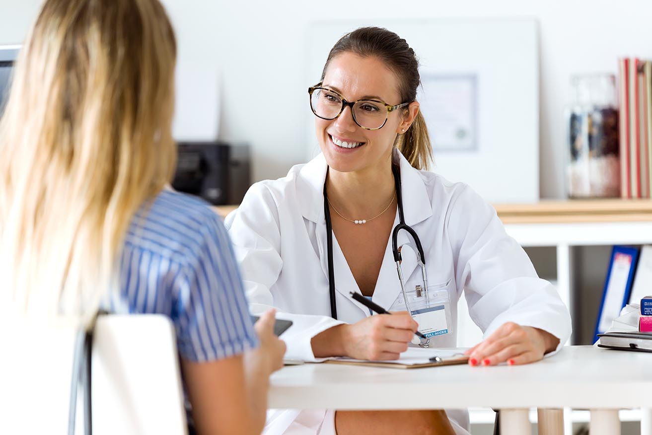 Portrait of female doctor explaining diagnosis to her patient.